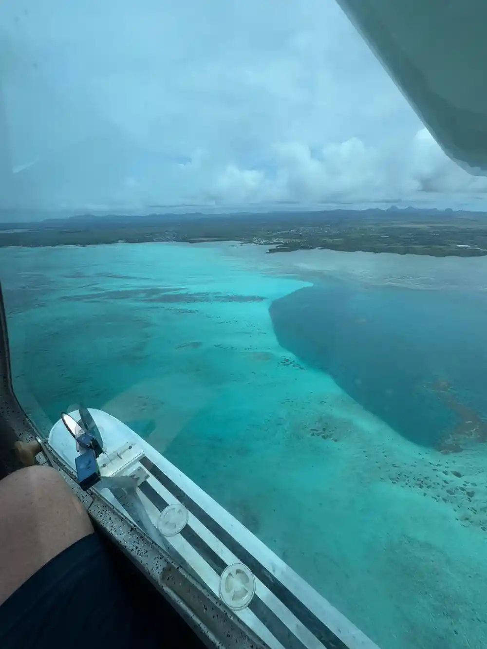 A pale turquoise flat with the float in frame