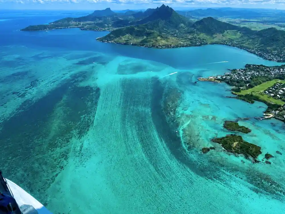 The underwater waterfall illusion: sediment streaming off the shelf beside a green coast